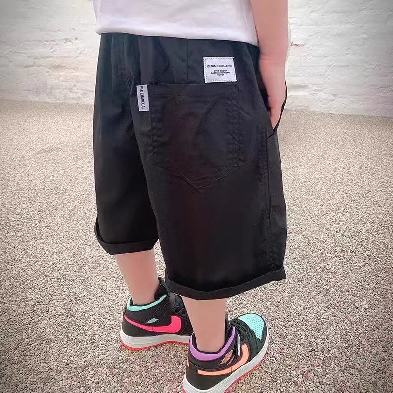 Quần đùi trẻ em 2025 nhãn hiệu sáng tạo màu trơn quần đùi mùa hè bé trai kiểu dáng thời trang quần trẻ nhỏ