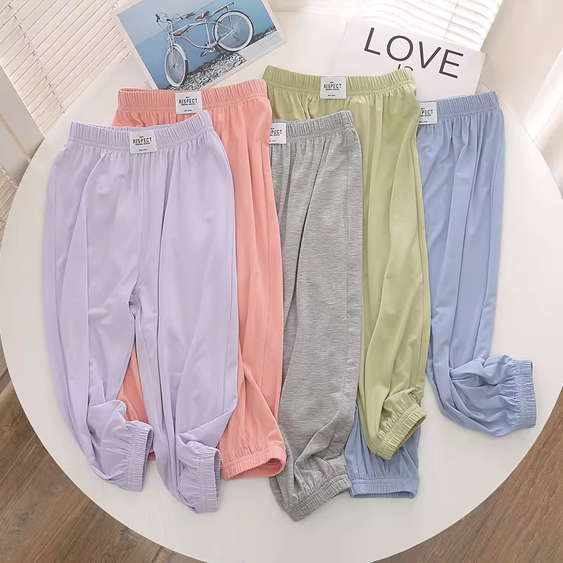Quần áo trẻ em quần chống muỗi modal cho bé gái 22 mùa hè mới dáng rộng thể thao quần dài co giãn cho trẻ em quần dài chín điểm hợp thời trang
