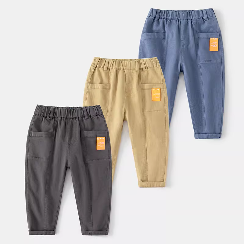 Quần trẻ em thường ngày xuân thu 2025 phong cách Hàn Quốc màu trơn quần cargo cotton rộng rãi thời trang cho bé trai kiểu xuân