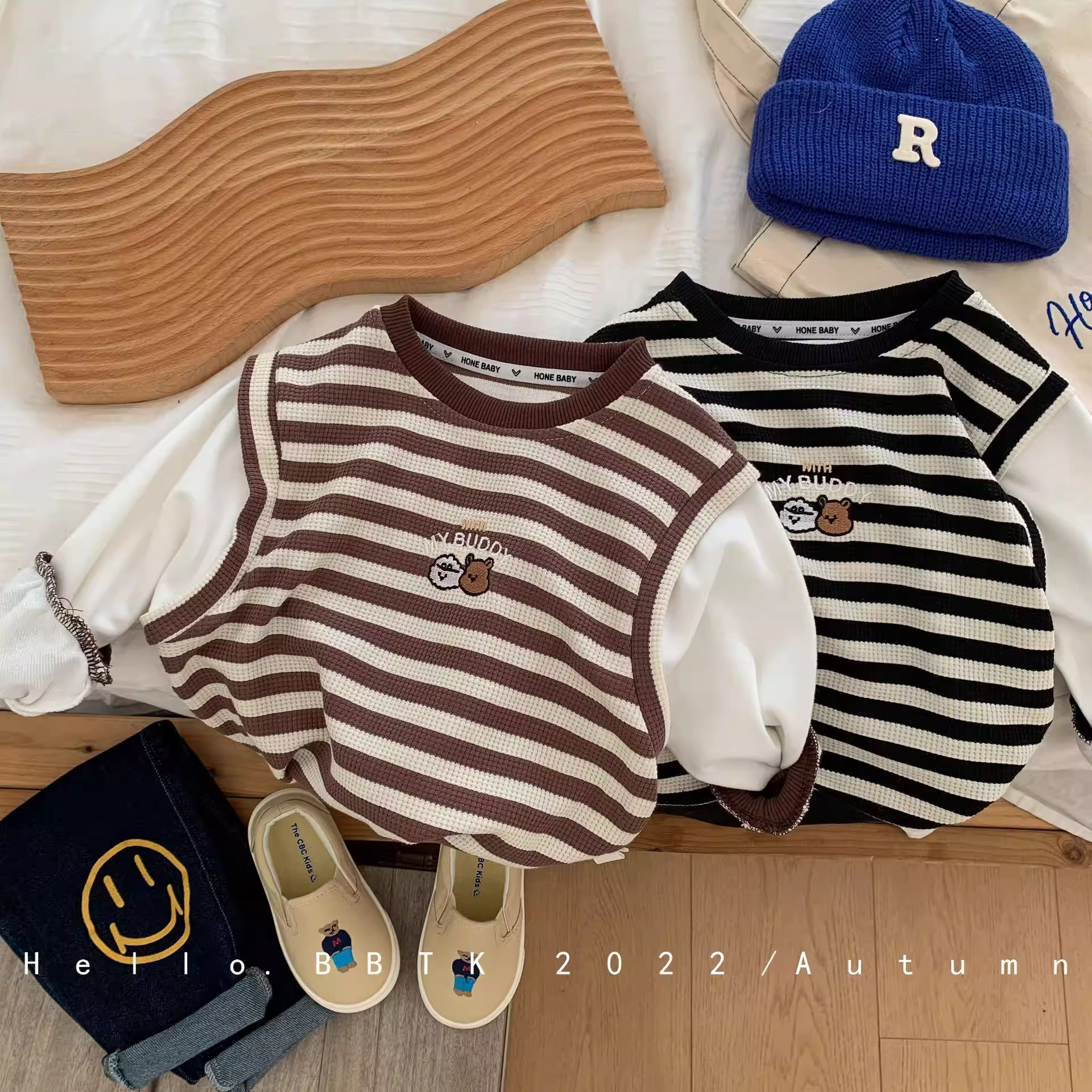 Áo len chui đầu trẻ em xuân 2025 kiểu Hàn Quốc sản phẩm mới xuân thu bé trai sọc thêu hình gấu giả hai lớp tay dài thời trang