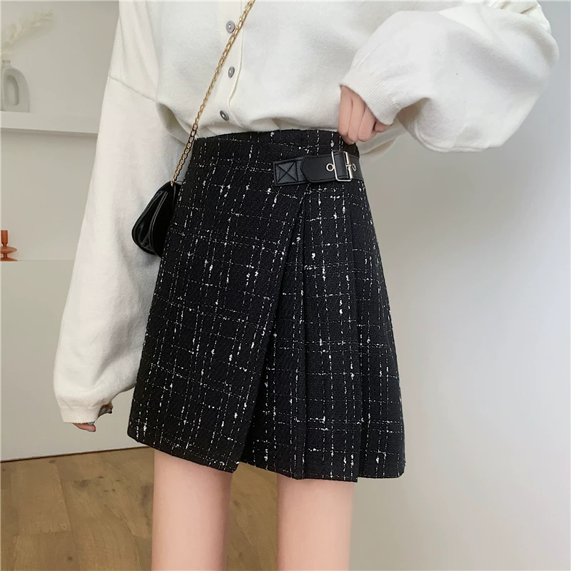 Quần váy xếp ly không đều màu đen bằng len cỡ lớn dành cho nữ, váy chữ A ôm hông lưng cao, váy ngắn mùa thu đông.