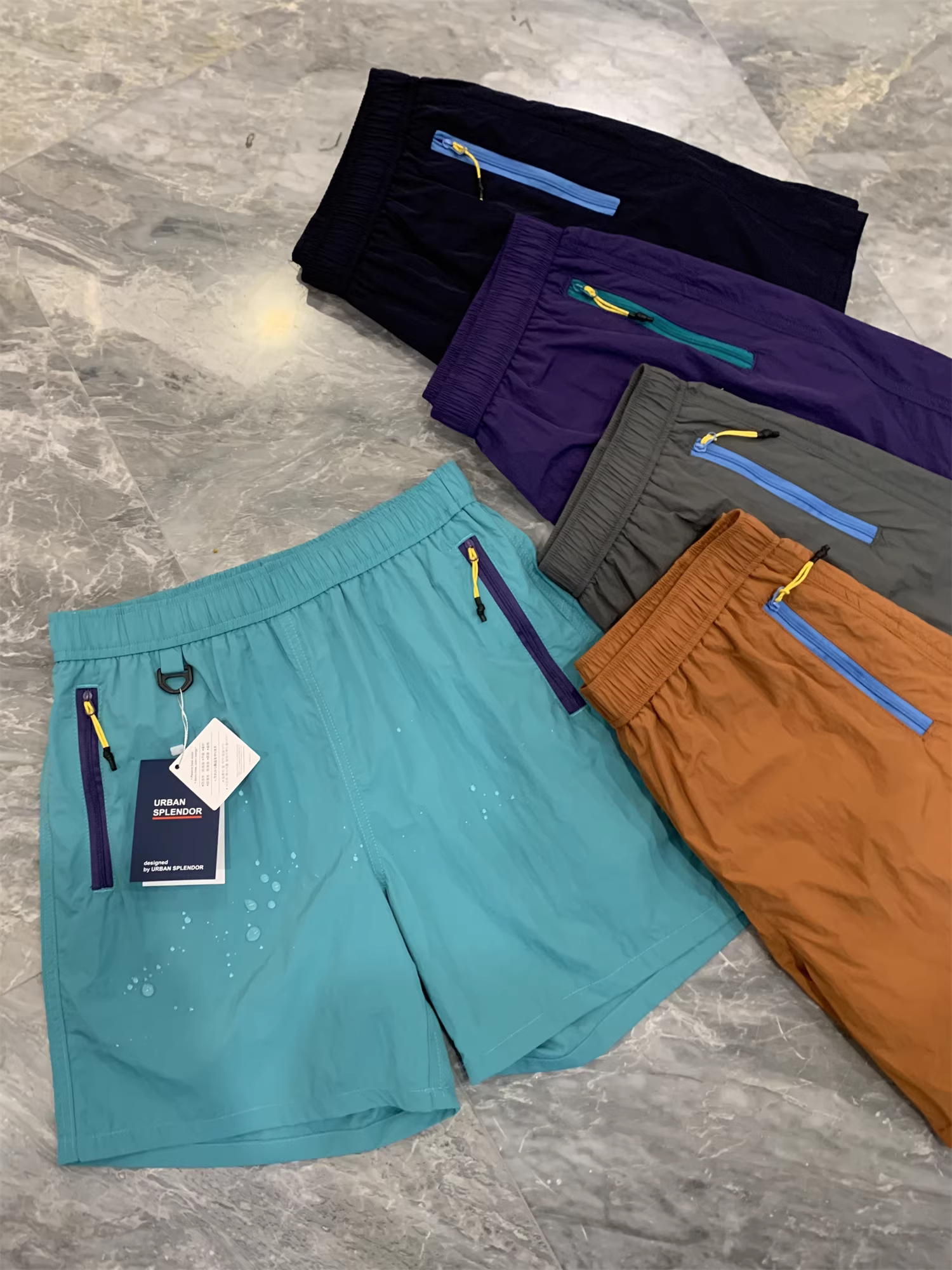 Don Quixote Mountain Series Outdoor! Nhanh khô và thoáng khí! Xu hướng quần short thể thao có khóa kéo màu khối mùa hè dành cho cả nam và nữ.