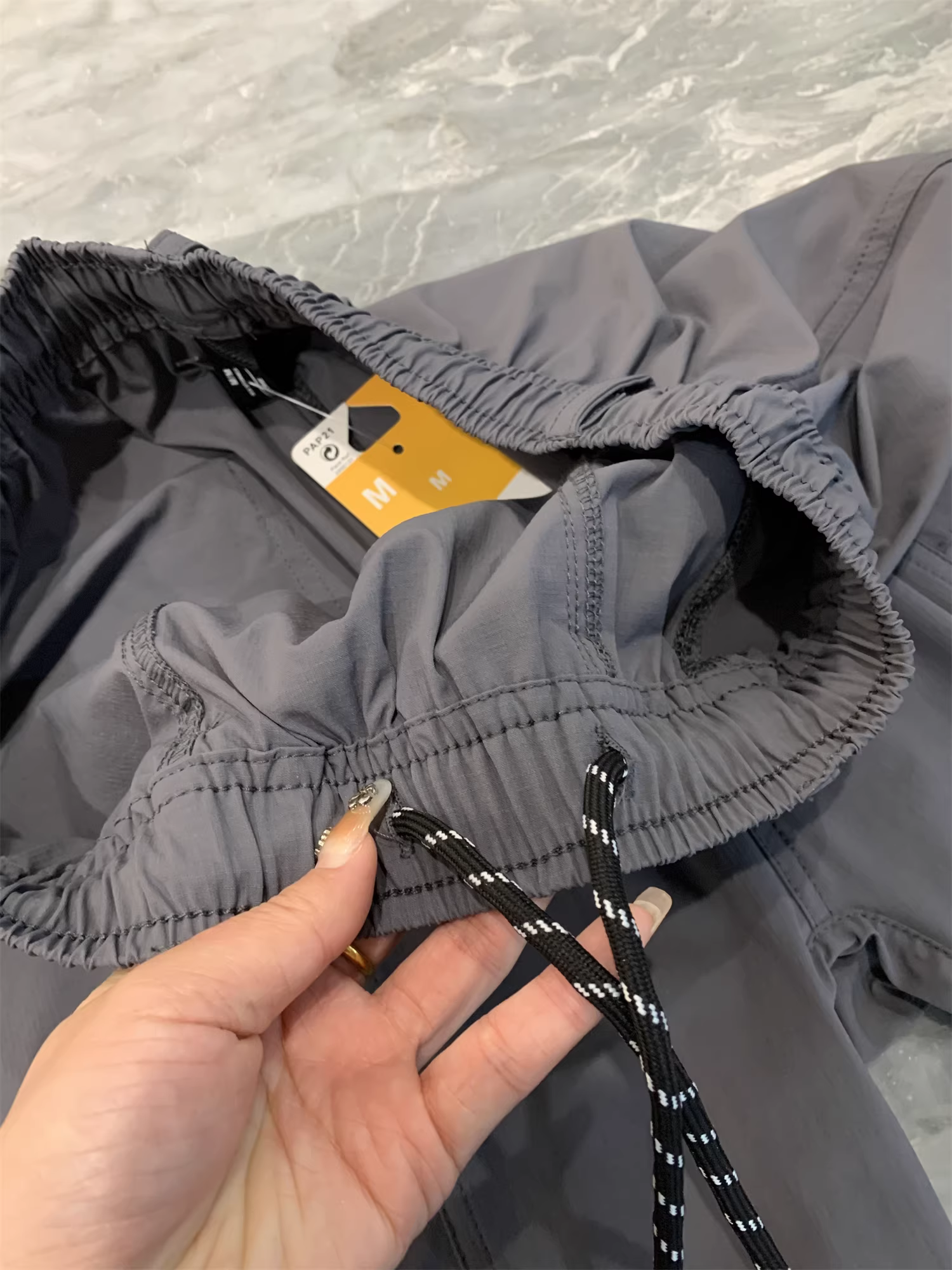 Don Quixote U series! Jingkouke cung cấp quần short năm điểm đa năng, thoáng khí, nhanh khô, kẻ ô nhỏ 50D dành cho nam.