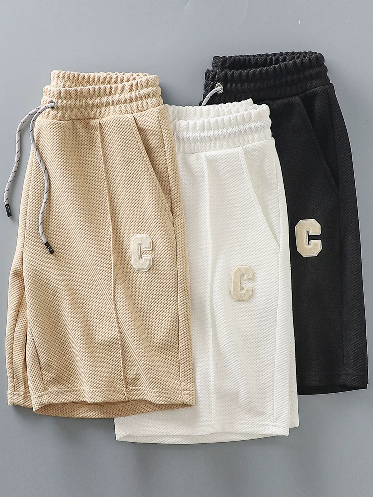 Quần short waffle phong cách Mỹ OMZM dành cho nam, quần thể thao mỏng nhanh khô mùa hè, quần short năm điểm thêu chắp vá rộng rãi