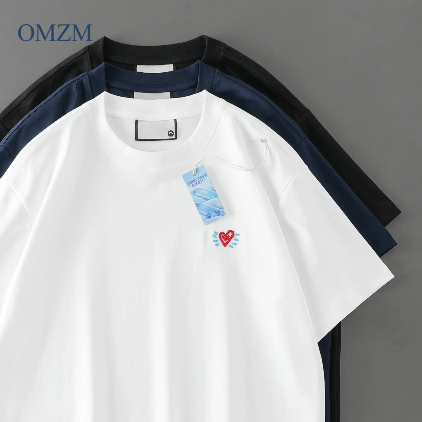 Áo thun ngắn tay thoáng mát bằng cotton được làm bóng OMZM 50 chiếc dành cho nam, áo thun ngắn tay thêu hình trái tim kiểu Mỹ mùa hè kiểu dáng rộng rãi dành cho cặp đôi