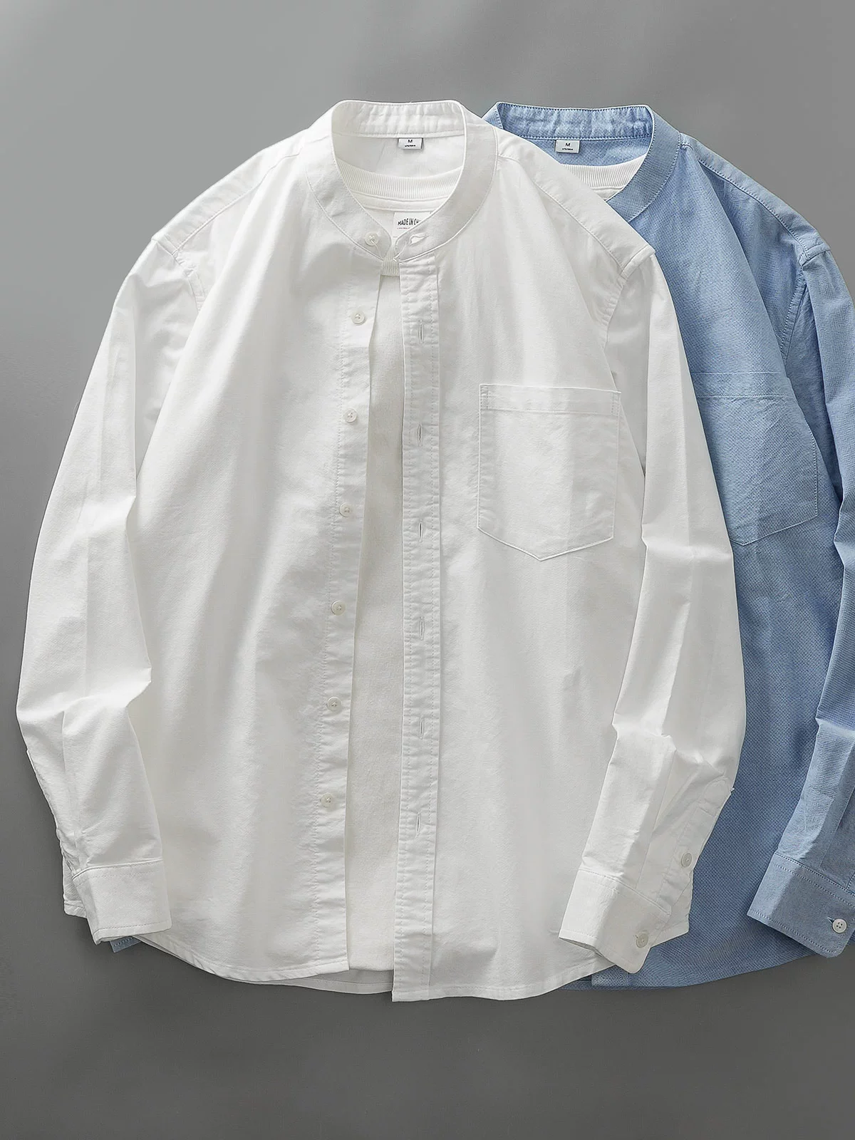 OMZM Áo sơ mi Oxford cotton nguyên chất hạng nặng kiểu Mỹ nam dài tay mùa thu áo sơ mi cổ đứng màu trắng áo khoác dáng rộng giản dị