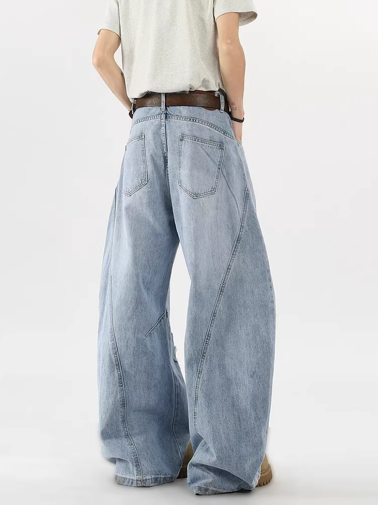 Wukong có sẵn quần jean nam kiểu Mỹ thời thượng, thiết kế phá cách, phối vải, rách, dáng lửng, ống rộng, dài chạm sàn.