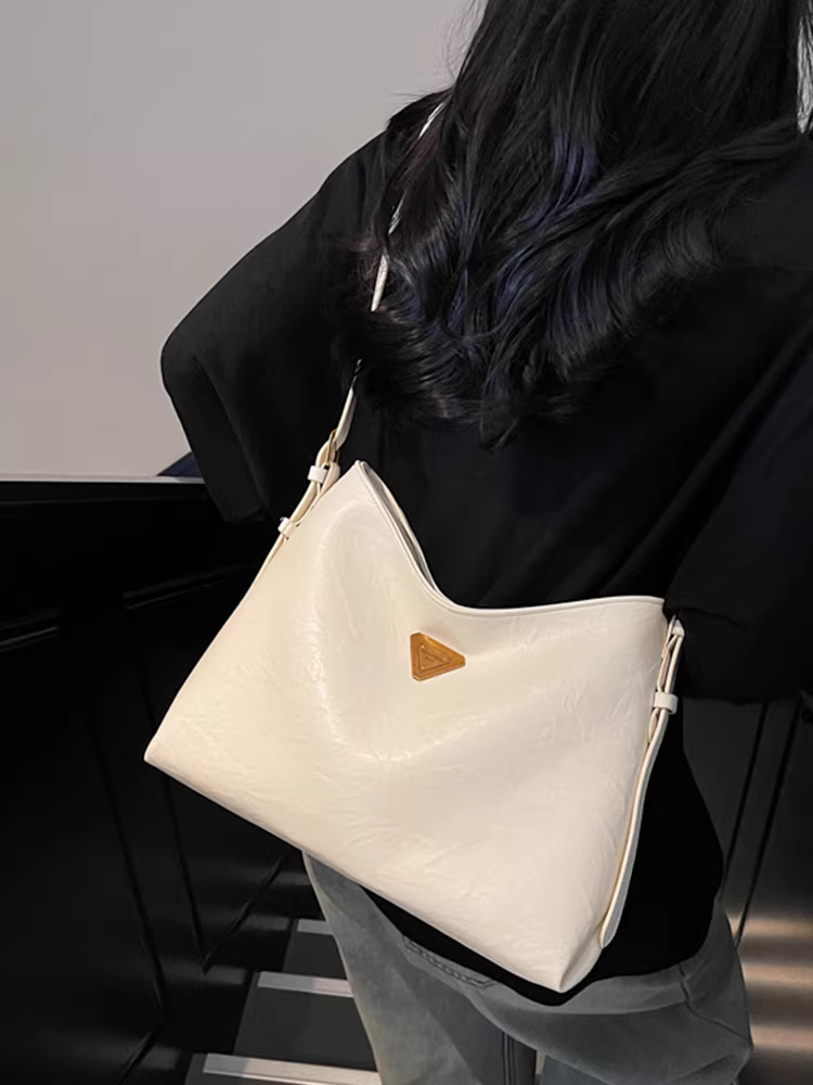 Túi xách nữ dung tích lớn, kiểu mới xuân hè 2025, đa năng, đơn giản, đeo vai/chéo, phong cách giản dị, túi bucket hot trend năm nay.