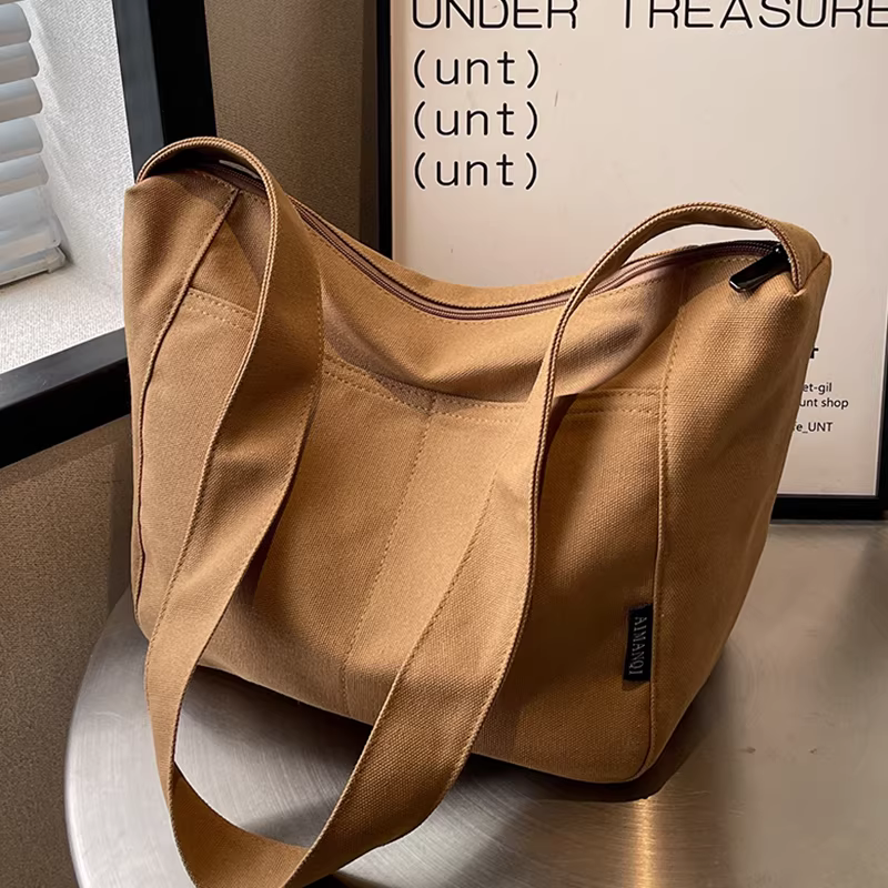 Túi vải canvas nữ, dung tích lớn, thời trang mới 2025, túi đeo chéo dây rộng đa năng thu đông, túi bucket thời thượng dành cho nữ.