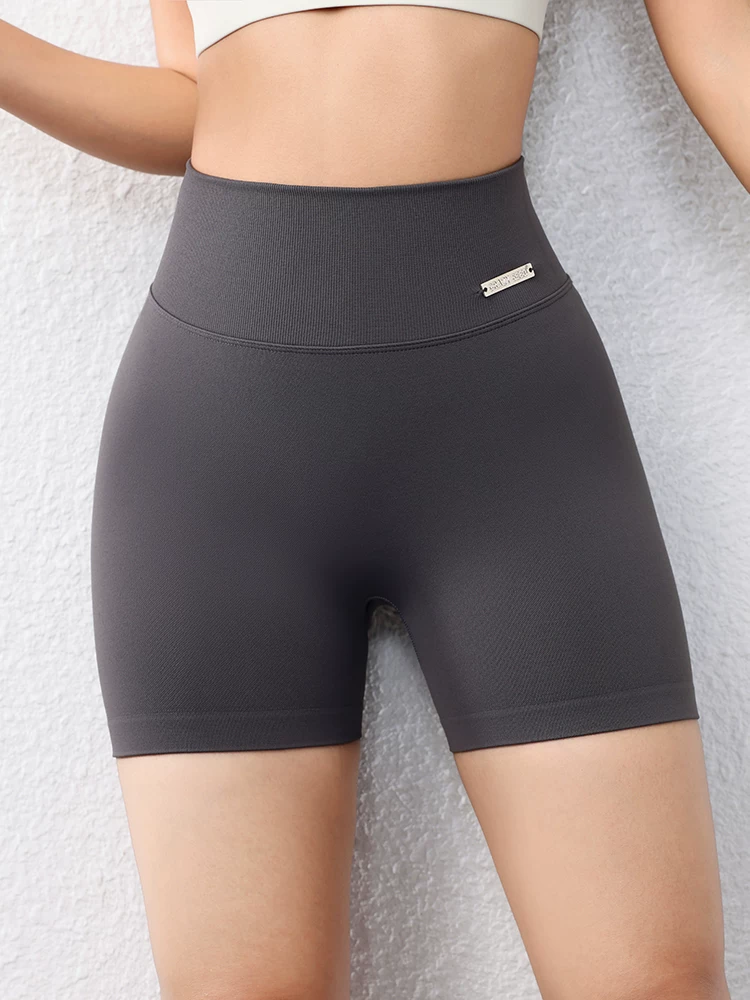 Quần short ôm sát nâng mông dành cho nữ màu đào, quần short tập thể dục phong cách Âu Mỹ không đường may, nhanh khô, quần tập yoga chạy bộ dài ba phần tư.