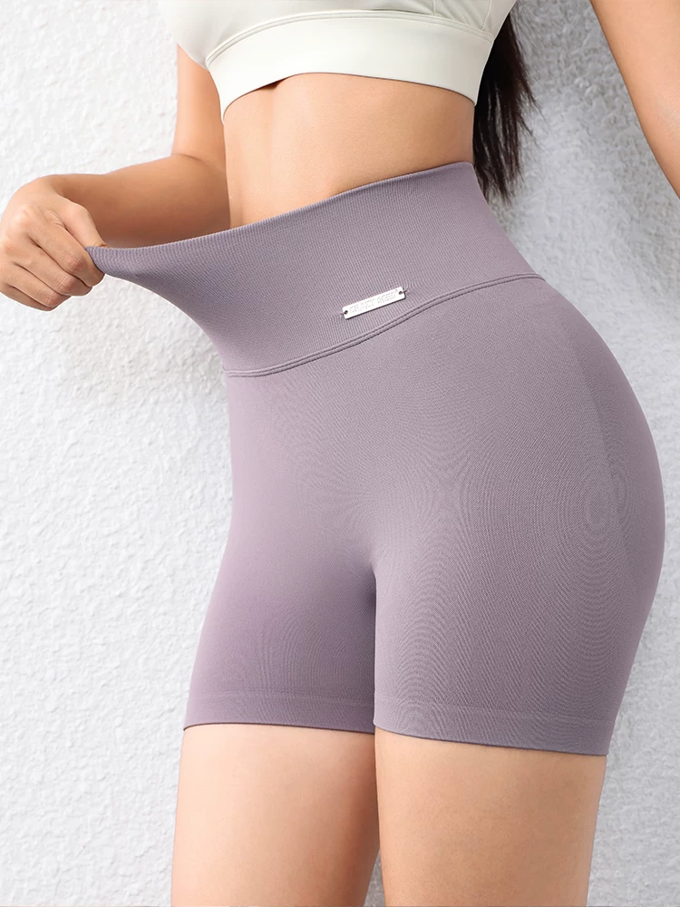 Quần short ôm sát nâng mông dành cho nữ màu đào, quần short tập thể dục phong cách Âu Mỹ không đường may, nhanh khô, quần tập yoga chạy bộ dài ba phần tư.