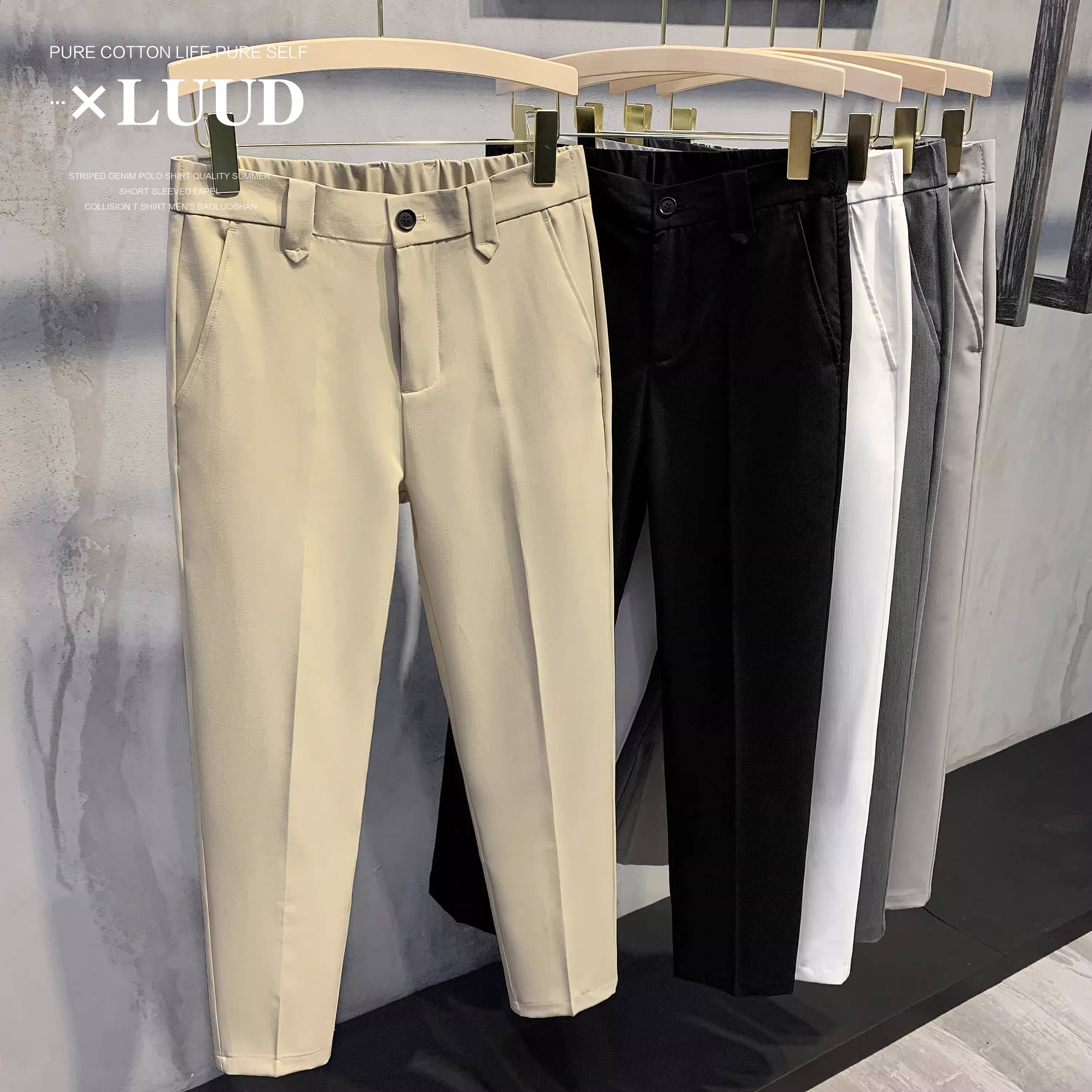 Quần tây nam LUUD màu trắng, lưng thun nửa phần, kiểu dáng ôm sát, phong cách quý ông Anh, dáng thẳng, ống lửng.