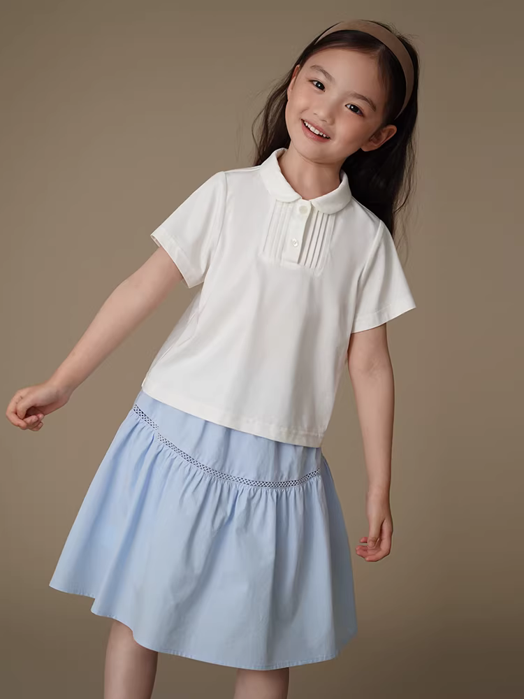 Quần áo trẻ em mùa hè áo dệt kim màu trắng áo sơ mi búp bê bé gái áo thun ngắn tay cho trẻ lớn đơn giản giản dị