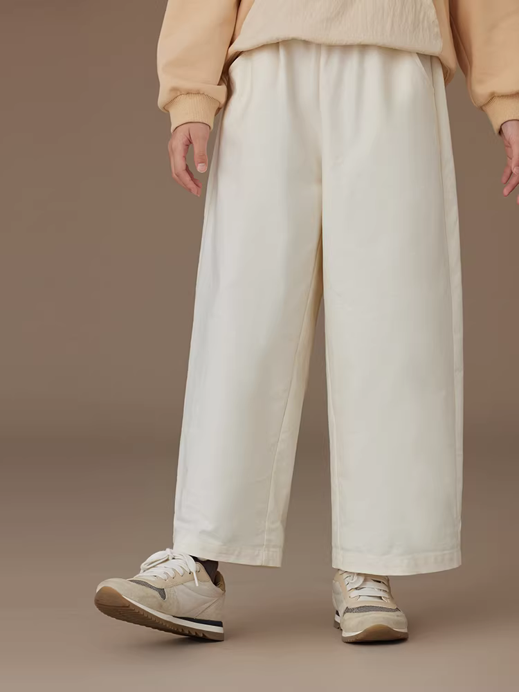 Quần áo trẻ em quần âu màu trắng nhạt cho mùa xuân và mùa thu, quần dài cotton thân thiện với làn da cho bé trai và bé gái, quần ống thẳng sành điệu.