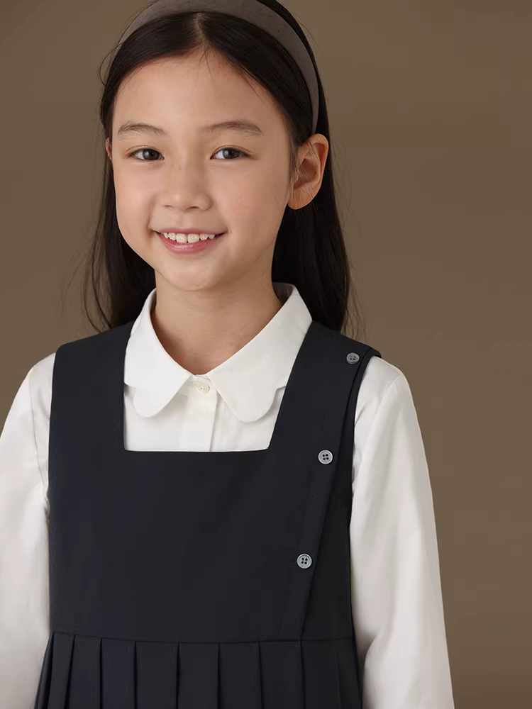 Quần áo trẻ em cho mùa xuân và mùa thu, váy kiểu học sinh trẻ em, váy xếp ly cổ vuông, váy hai dây không tay cho bé gái.