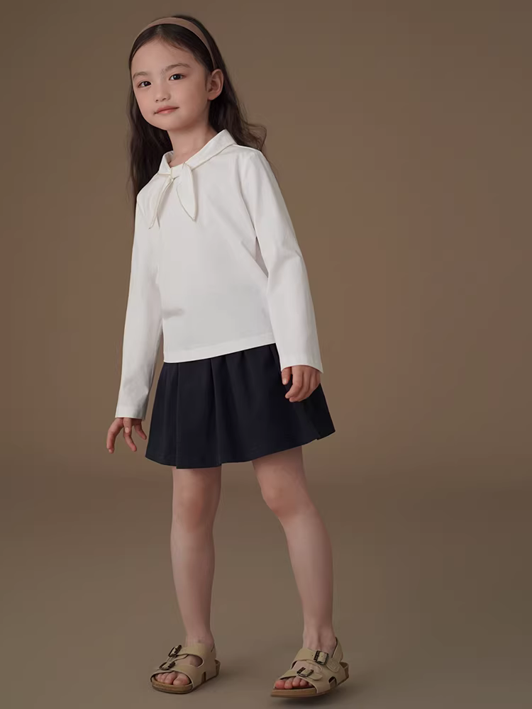 Áo thun bé gái tay dài màu trắng, kiểu dáng dễ thương, phối nơ, chất liệu len, thích hợp cho mùa xuân thu.