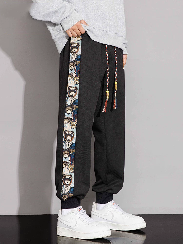 Quần jogger thể thao nam Jeanswest theo xu hướng quốc gia, kiểu mới xuân thu 2026, quần ống đứng size lớn phong cách Mỹ cao cấp.