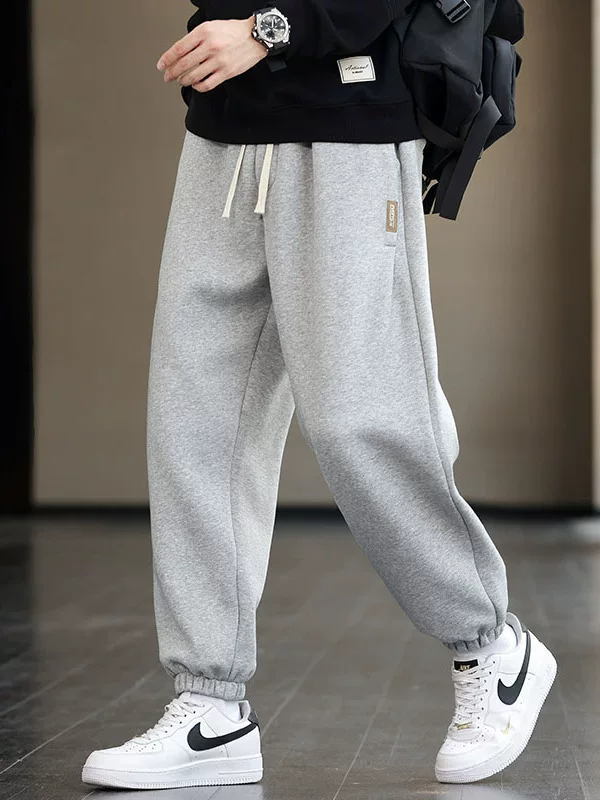 Quần jogger thể thao đa năng thiết kế nhãn màu trơn của Jeanswest, quần thể thao nam mới mùa xuân thu, quần thể thao thông thường
