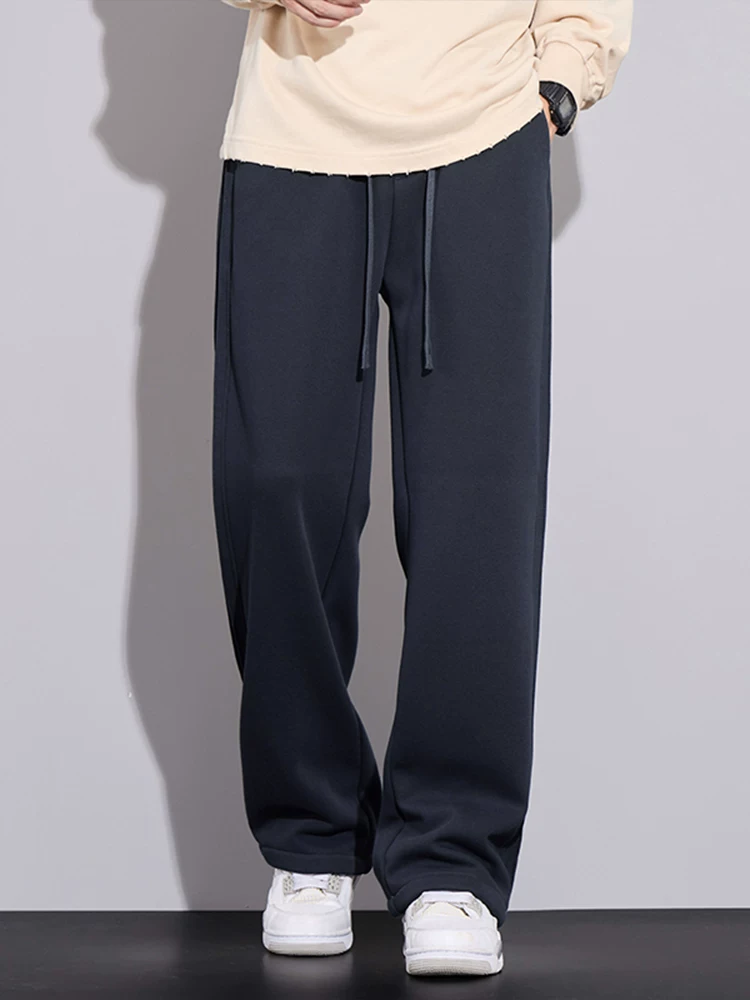 Quần thể thao dáng rộng cao cấp của Jeanswest dành cho nam, quần dài màu đen dáng rộng phong cách Mỹ hợp thời trang mùa xuân thu.