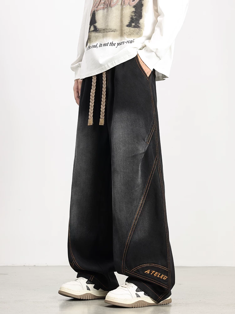 Quần jean thêu viền cong thông thường của Jeanswest dành cho nam, mùa xuân và mùa thu, cỡ lớn, quần ống rộng màu đen dáng rộng.