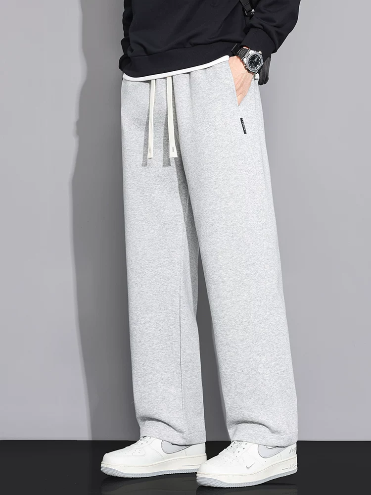 Quần jeanswest ống rộng dáng suông dành cho nam, quần thể thao dáng rộng màu trơn hợp thời trang mùa xuân.