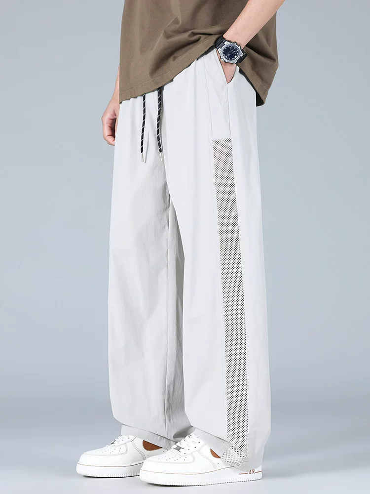 Quần dài ống đứng chất liệu lụa băng kiểu Mỹ của Jeanswest dành cho nam, quần dài thoáng mát mùa hè, dáng rộng hợp thời trang, thân thiện với làn da, thoáng khí.