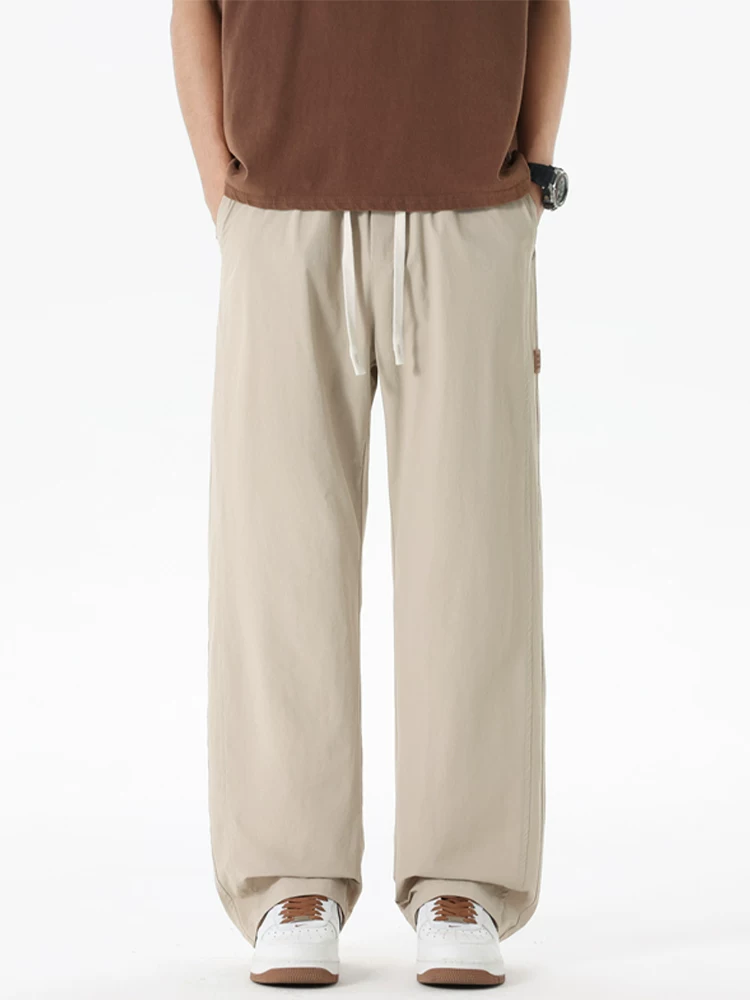 Quần jeanswest ống rộng phong cách Mỹ thời thượng dành cho nam, mùa xuân thu, dáng rộng cao cấp, quần thể thao đa năng.