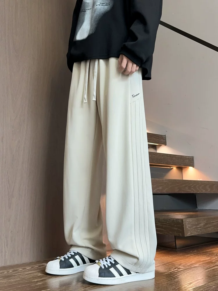 Quần dài ống đứng màu đen phong cách Mỹ của Jeanswest dành cho nam, mẫu mới mùa xuân 2026, quần dài cao cấp, quần thể thao.