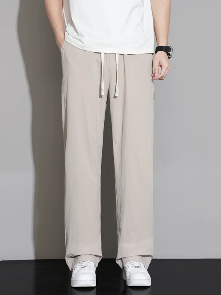 Quần dài dáng rộng cao cấp của Jeanswest dành cho nam, mùa xuân thu phong cách Mỹ, thương hiệu thời thượng, quần dài dáng suông đa năng, phong cách thời trang.
