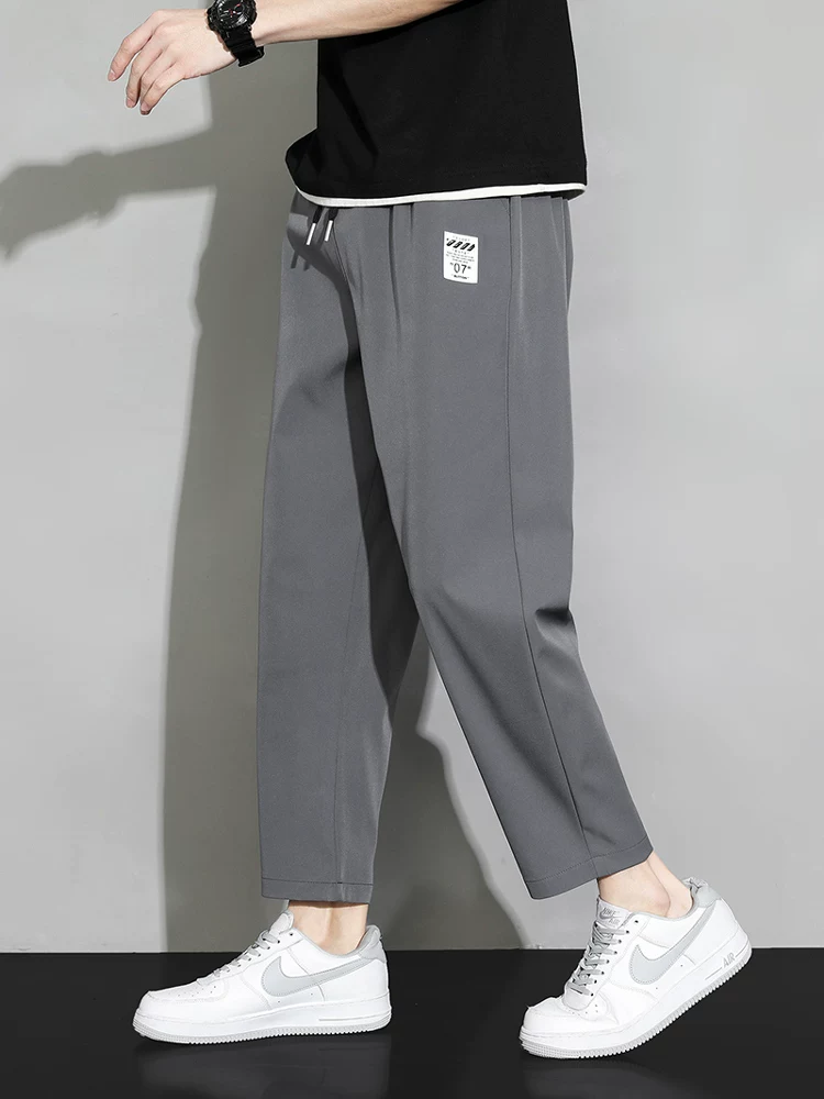 Quần dài mùa hè mỏng chất liệu lụa đá chín phần của Jeanswest dành cho nam, kiểu dáng đa năng, rộng rãi, thẳng, nhanh khô, thoáng khí, quần thể thao.
