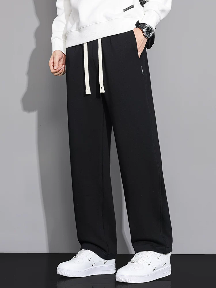Quần thể thao nam Jeanswest kiểu Mỹ, dáng thẳng, cạp cao, chất liệu thun, mẫu mới xuân thu 2026, quần dài cao cấp, phong cách thường ngày.