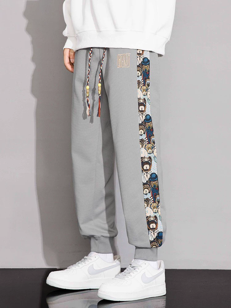Quần jogger thể thao nam Jeanswest theo xu hướng quốc gia, kiểu mới xuân thu 2026, quần ống đứng size lớn phong cách Mỹ cao cấp.