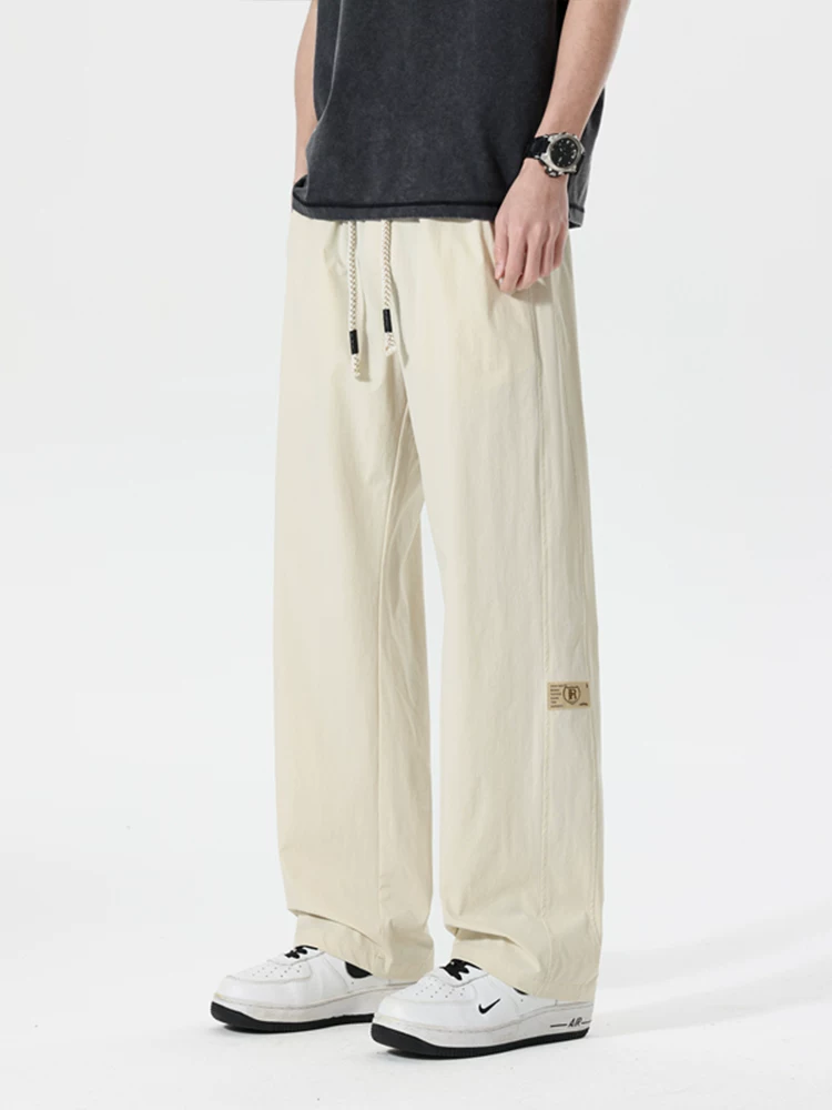 Quần dài ống rộng kiểu Mỹ thời thượng của Jeanswest dành cho nam, mùa xuân hè, cảm giác cao cấp, dáng rộng, quần dài đa năng.
