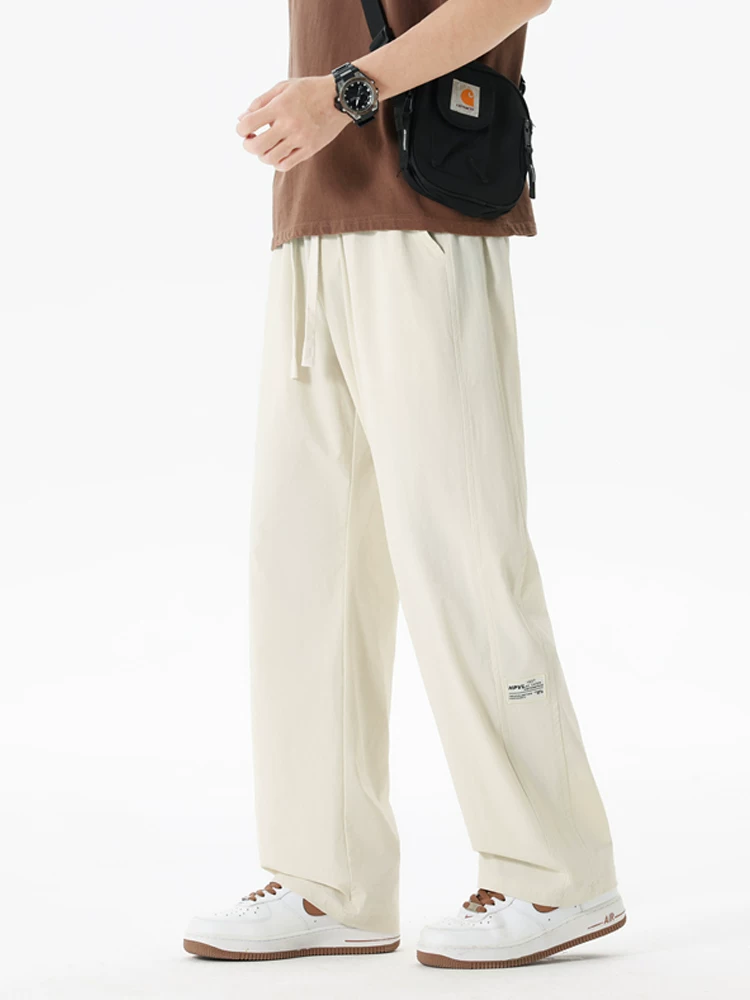 Quần Jeanswest nam ống thẳng Quần dài dáng rộng hợp thời trang mùa xuân Thương hiệu thời trang cao cấp Quần dài ống rộng rộng rãi