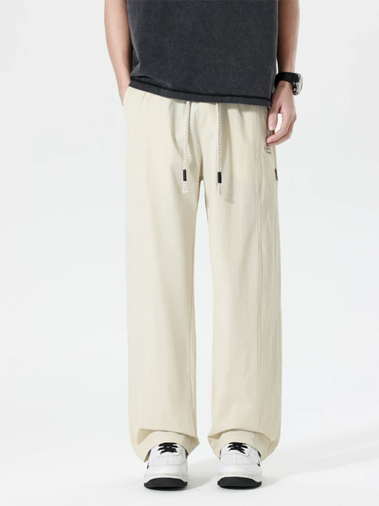 Quần dài thể thao ống đứng phong cách Mỹ thời thượng của Jeanswest dành cho nam, mùa xuân hè, cảm giác cao cấp, dáng rộng, đa năng, thoáng khí.