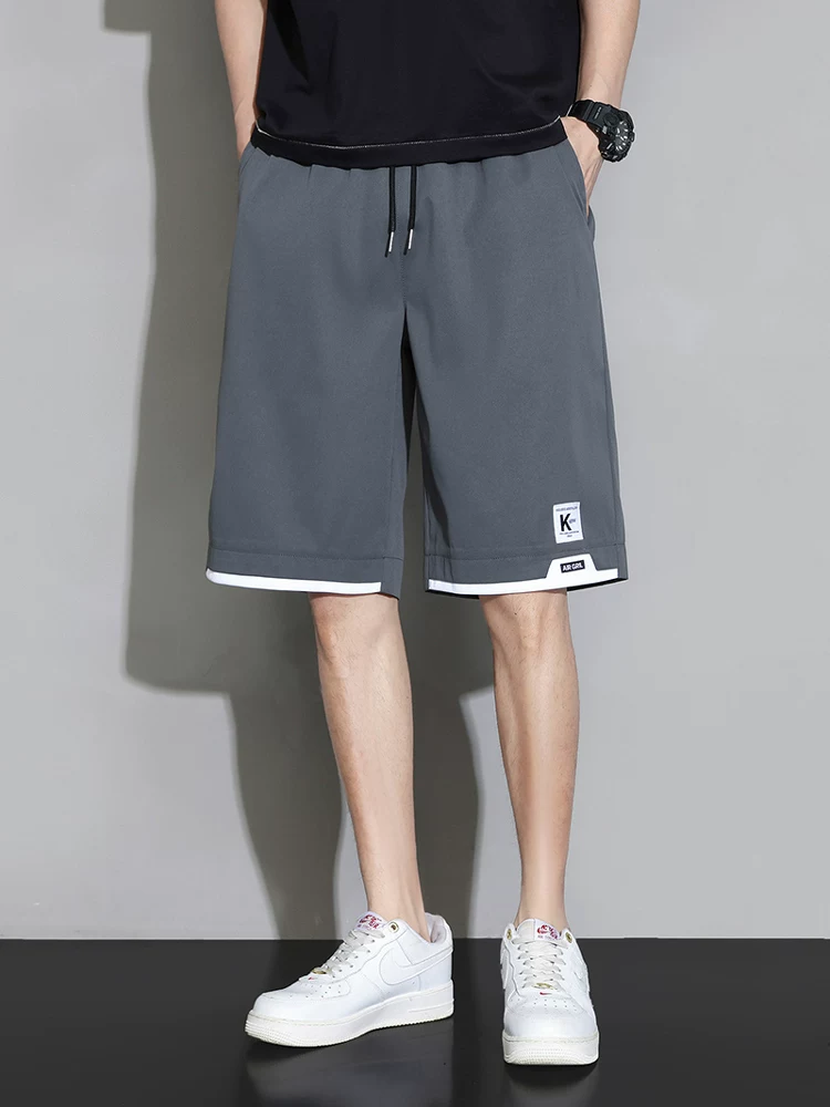 Quần short nhanh khô chất liệu lụa băng Jeanswest dành cho nam, quần năm phần mỏng thoáng mát mùa hè, quần dài vừa phải rộng rãi đa năng dành cho học sinh.