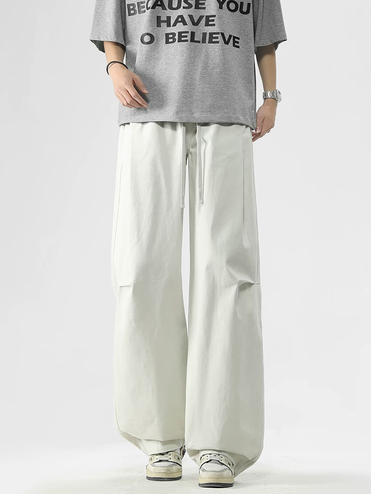 Quần jeanswest kiểu Mỹ thời thượng, dáng rộng, phong cách casual dành cho nam, mẫu mới xuân thu 2026, quần cargo dây rút cao cấp.