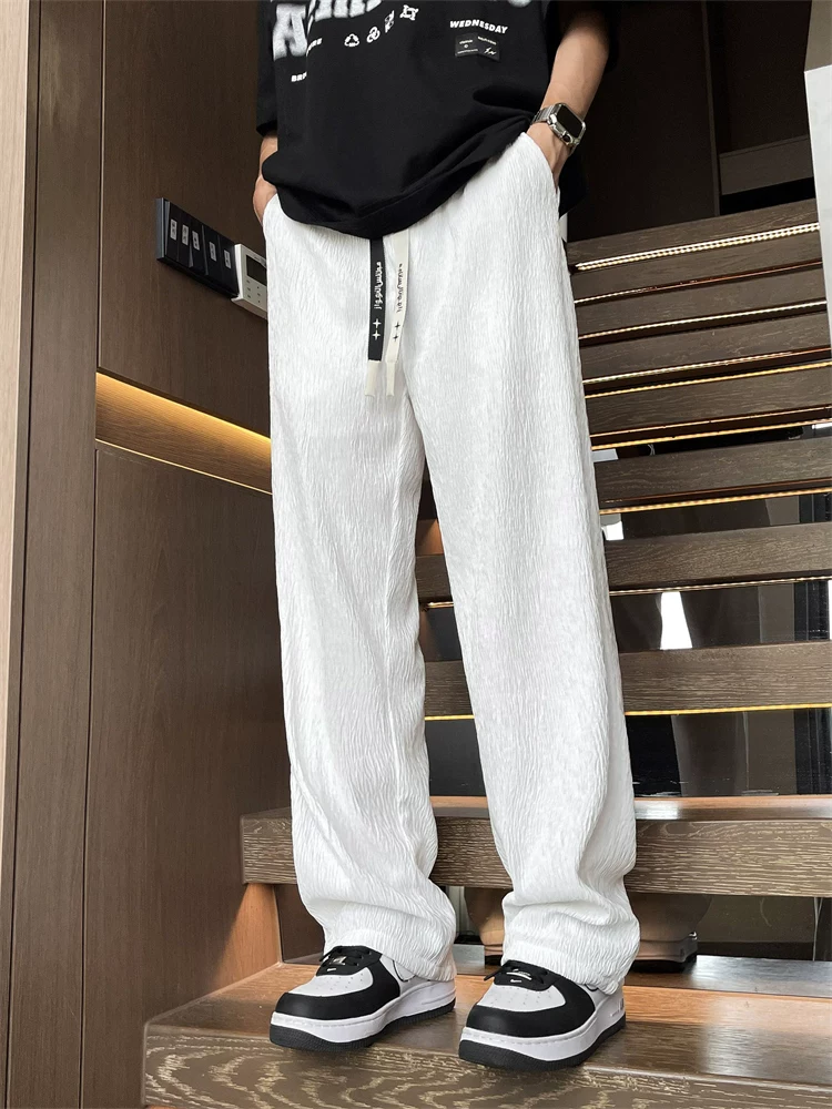 Quần jeanswest ống rộng màu đen dáng suông dành cho nam, quần thể thao dáng rộng đơn giản, đa năng mùa xuân.