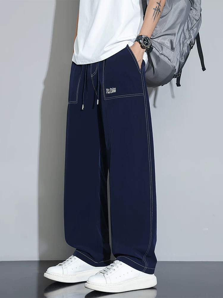 Quần âu nam Jeanswest 2025 chất liệu lụa đá mới, quần ống rộng dáng thẳng mỏng mùa hè, quần suông nhanh khô, chất liệu mềm mại.