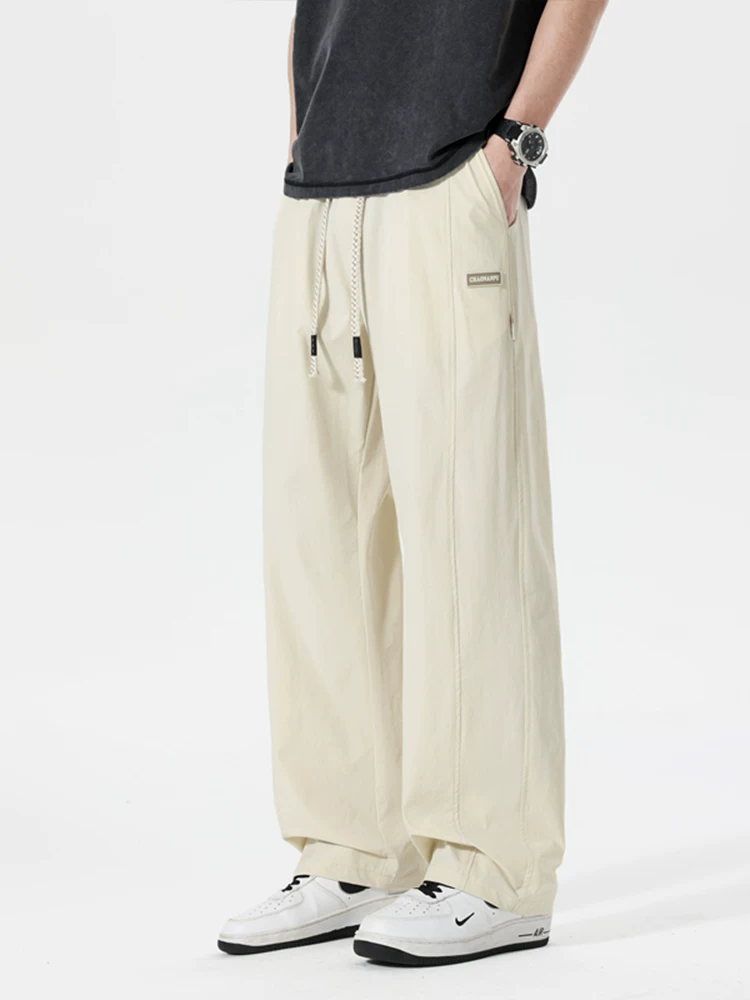 Quần dài thể thao ống đứng phong cách Mỹ thời thượng của Jeanswest dành cho nam, mùa xuân hè, cảm giác cao cấp, dáng rộng, đa năng, thoáng khí.