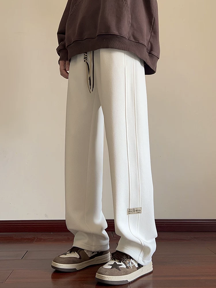 Quần dài nam Jeanswest phong cách Mỹ, màu đen, thời trang, xu hướng mới xuân thu 2026, chất liệu cao cấp, dáng rộng.