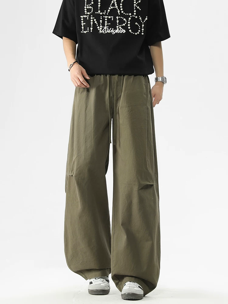 Quần jeanswest kiểu Mỹ thời thượng, dáng rộng, phong cách casual dành cho nam, mẫu mới xuân thu 2026, quần cargo dây rút cao cấp.