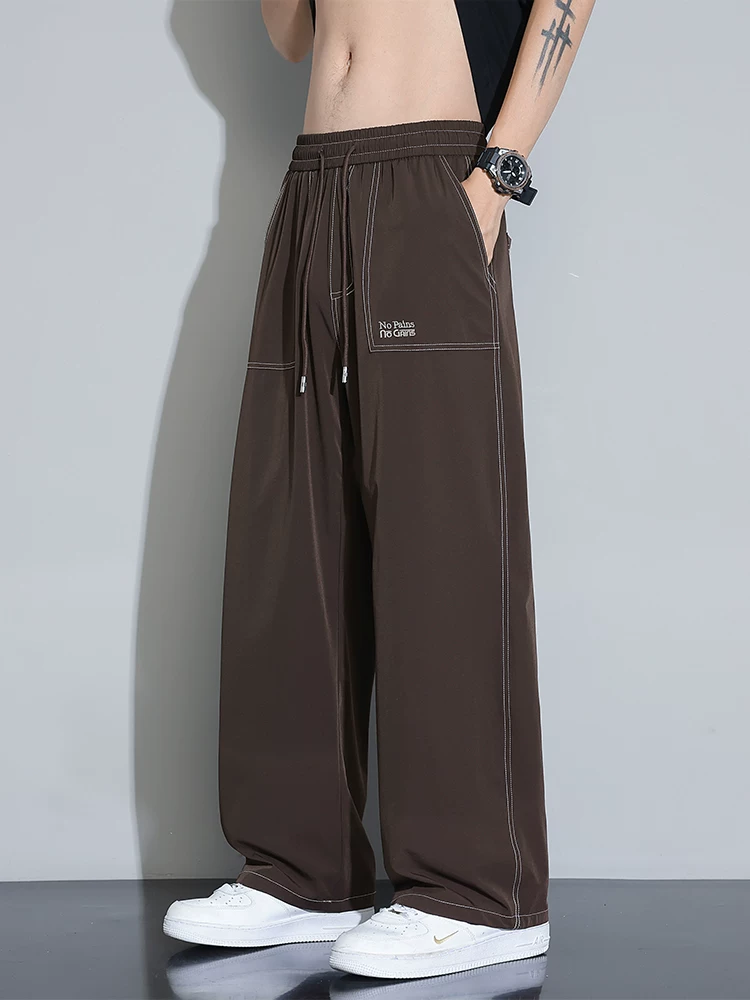 Quần âu nam Jeanswest 2025 chất liệu lụa đá mới, quần ống rộng dáng thẳng mỏng mùa hè, quần suông nhanh khô, chất liệu mềm mại.