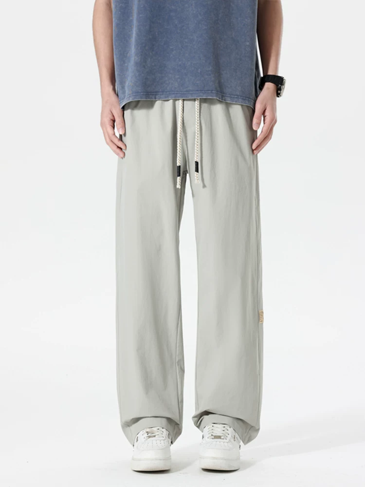 Quần dài ống rộng kiểu Mỹ thời thượng của Jeanswest dành cho nam, mùa xuân hè, cảm giác cao cấp, dáng rộng, quần dài đa năng.