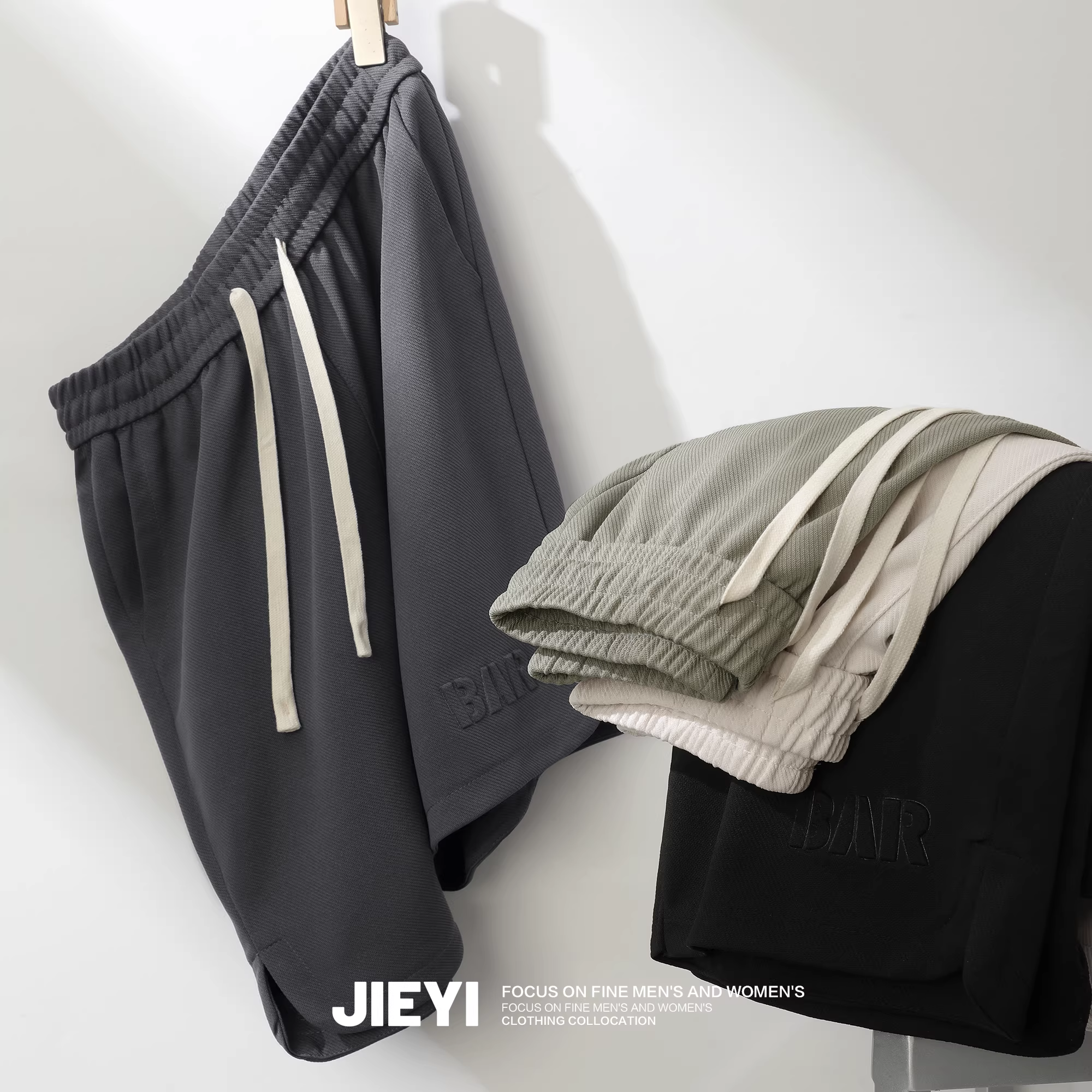 Quần short thể thao ngoài trời JIEYI, quần short năm phần đơn giản thời trang in nổi chữ tiếng Anh, có lưng thun dành cho nam