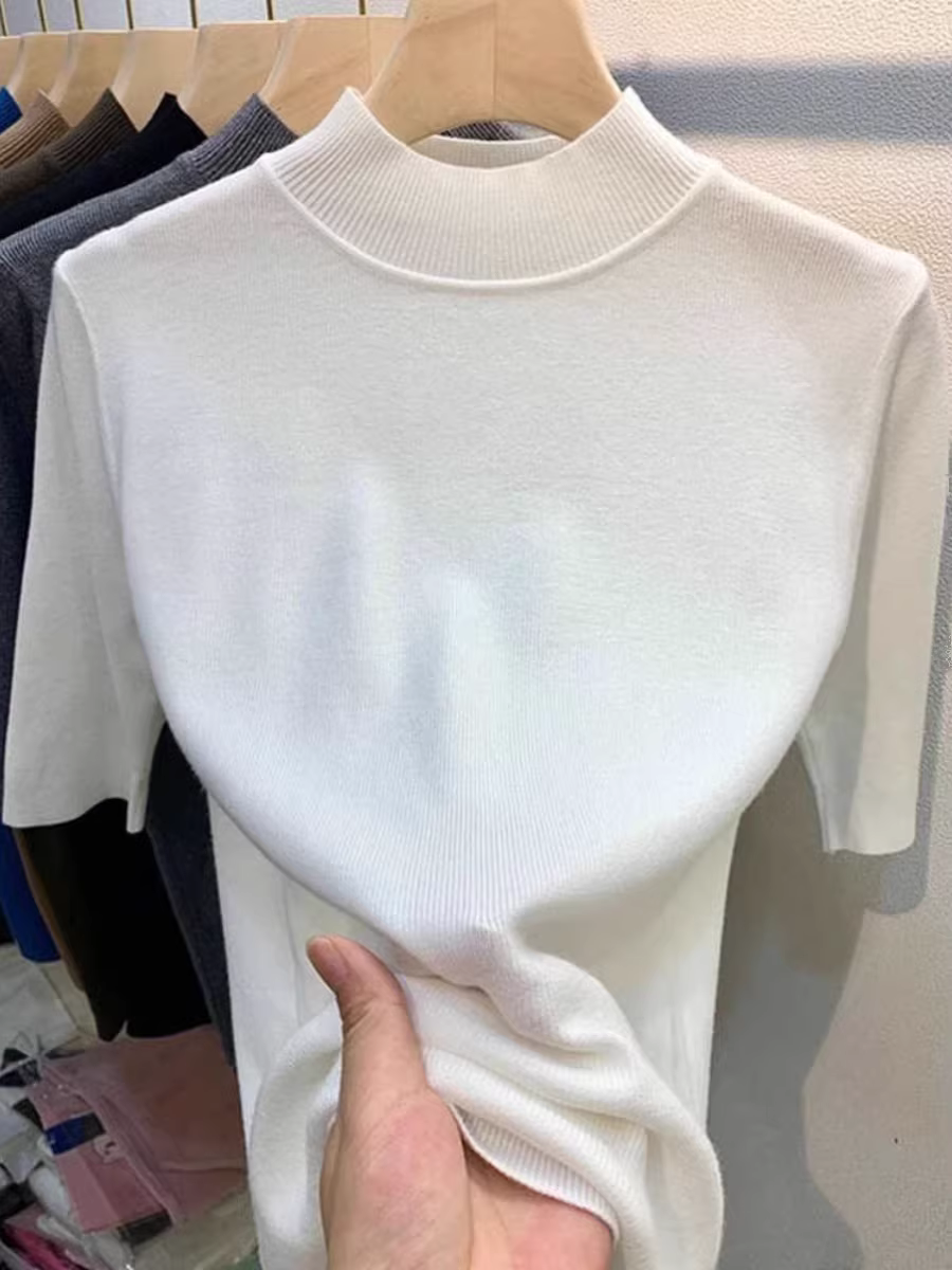 Quần áo nữ châu Âu giảm giá có thương hiệu, áo sơ mi cổ cao nửa cổ có nhãn cắt, lớp bên trong có áo dệt kim tay giữa, áo len ôm dáng thon gọn.