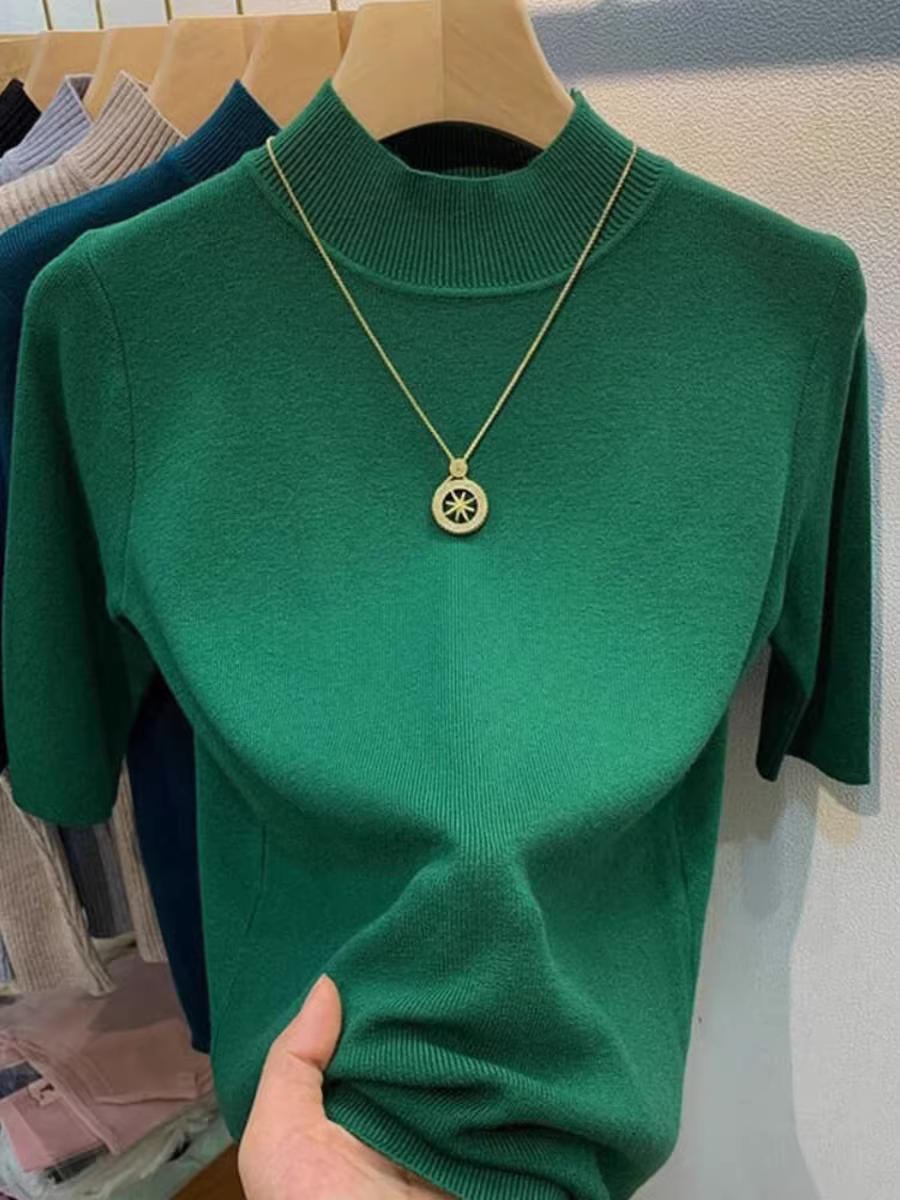 Quần áo nữ châu Âu giảm giá có thương hiệu, áo sơ mi cổ cao nửa cổ có nhãn cắt, lớp bên trong có áo dệt kim tay giữa, áo len ôm dáng thon gọn.