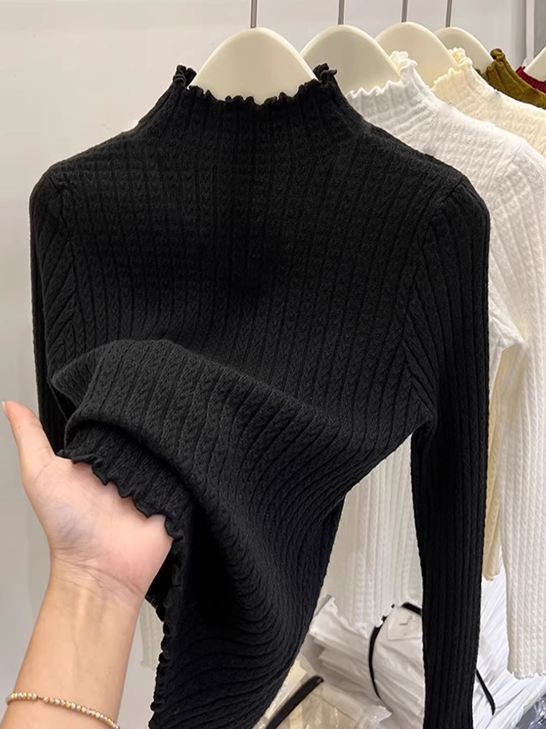 Quần áo nữ phong cách châu Âu Nanyou có nhãn cắt, viền xếp nếp, cổ cao nửa cổ, áo dệt kim cơ bản cho mùa thu đông, áo len ôm dáng, hợp thời trang.