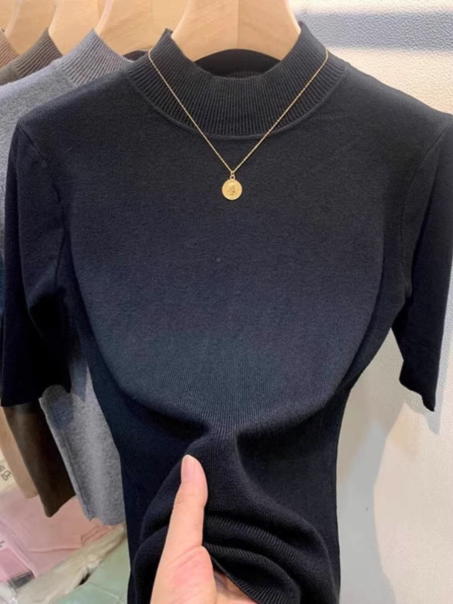 Quần áo nữ châu Âu giảm giá có thương hiệu, áo sơ mi cổ cao nửa cổ có nhãn cắt, lớp bên trong có áo dệt kim tay giữa, áo len ôm dáng thon gọn.