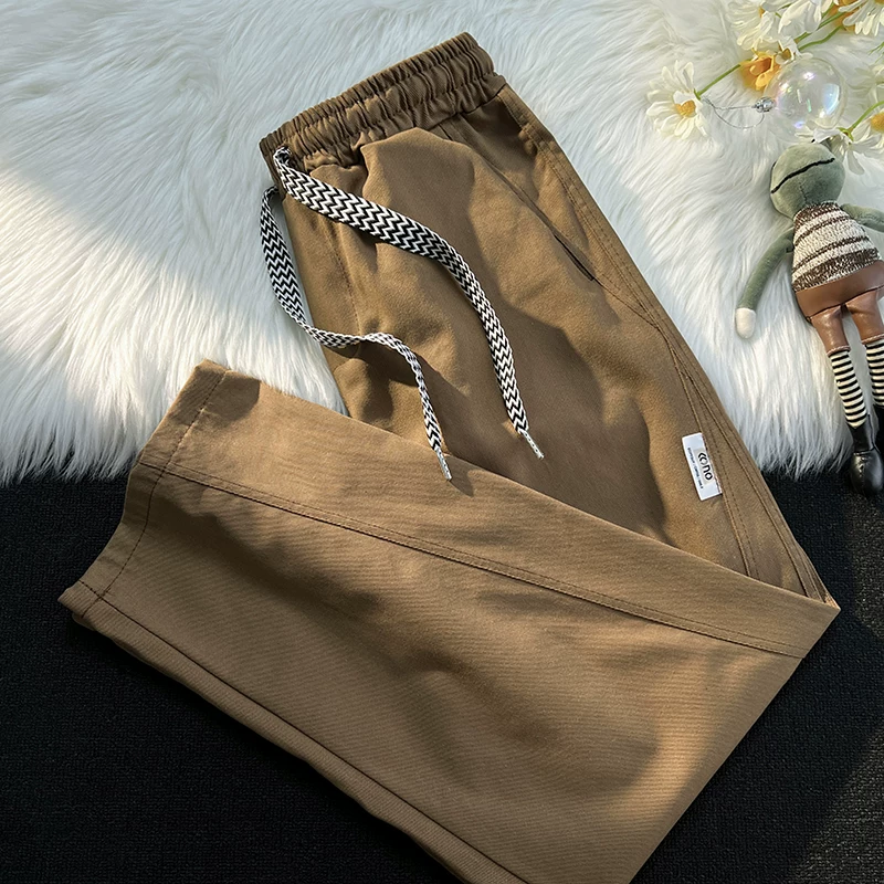 Quần công sở màu trơn cơ bản mùa xuân thu thương hiệu thời trang phong cách Nhật Bản quần nam giản dị đa năng quần dài ống rộng